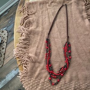 Handcrafted beaded necklace with leather band with clasp. 17”